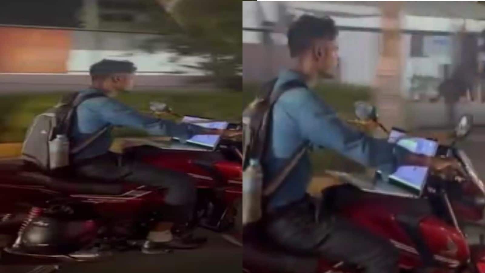 बाइक के फ्यूल टैंक पर लैपटॉप रखकर चला रहा था युवक, वीडियो देख लोग हुए हैरान